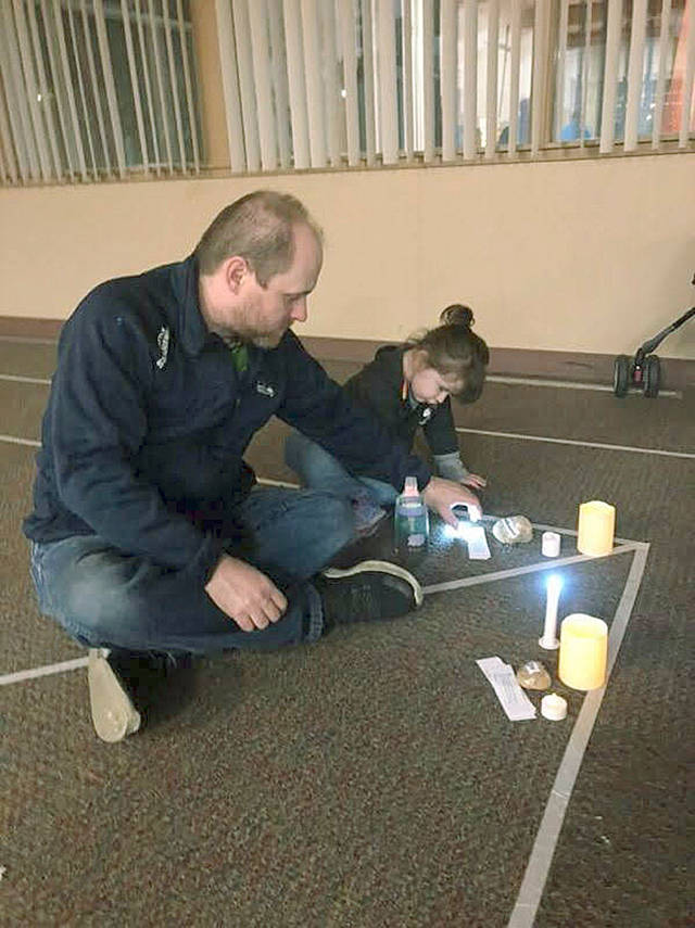 First United Methodist Church members Jason and Alessia Remillard spend time together in the candlelit prayer labyrinth. COURTESY PHOTO