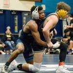 Auburn Riversides Yusef Nelson, left, ties up Auburns Alex Contreras during their 126-pound match Wednesday. Nelson won by fall at the 5:13 mark. RACHEL CIAMPI, Auburn Reporter