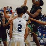 Auburns Isaiah Dunn drives inside to shoot over the Auburn Riverside zone during NPSL Olympic play Friday night. RACHEL CIAMPI, Auburn Reporter