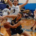 Auburns Jacklynn Smith collides with Autumn Lee on a drive to the basket during NPSL Olympic play Friday night. RACHEL CIAMPI, Auburn Reporter