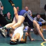 Auburn Riversides Jaden Cassel, top, ties up Auburns Dalton Whitehall-Gilkes in the 113-pound final. Cassel won by technical fall. RACHEL CIAMPI, Auburn Reporter