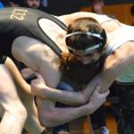 Auburns Gabe Sena, right, tangles with Enumclaws Aidan Carroll for the 132-pound final at the NPSL Olympic Division/sub-district tournament championships Saturday. Sena prevailed in dramatic fashion. RACHEL CIAMPI, Auburn Reporter