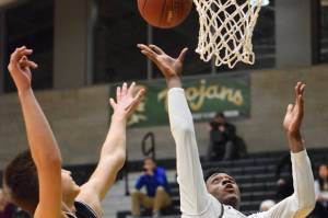 Storm covers Trojans in district playoff