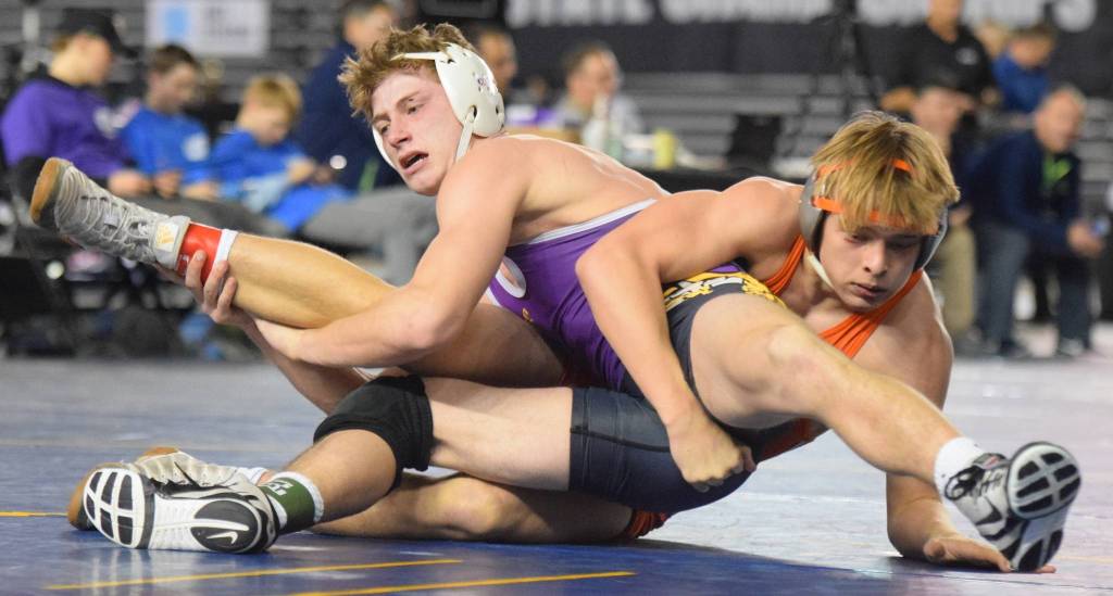 Auburn Mountainview senior Brennen Hanson, right, battles Puyallups Jace Coulter. Hanson scored a 6-0 decision to finish fifth at 152 pounds. RACHEL CIAMPI, Auburn Riverside.