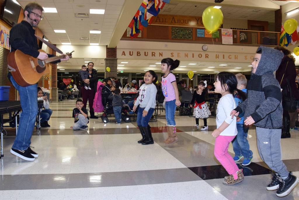 Eric Ode performs on stage at the Early Learning Center at the Auburn High School Commons. RACHEL CIAMPI, Auburn Reporter