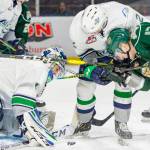 Thunderbirds defenseman Simon Kubicek (2) and the Silvertips Jackson Berezowski (17) battle for position as Seattle goalie Roddy Ross prepares to smother the puck during WHL play Saturday night. COURTESY PHOTO, Brian Liesse, T-Birds