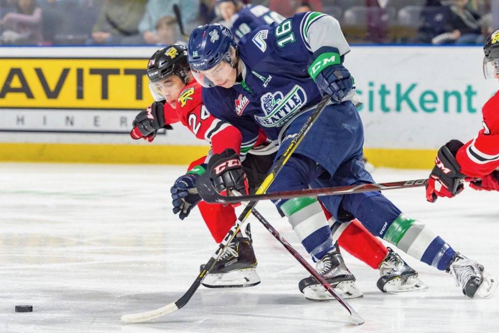 The Thunderbirds Noah Philp, right, drives the puck up the ice with the Winterhawks Seth Jarvis defending during their WHL game at the accesso ShoWare Center on Saturday night. COURTESY PHOTO, Brian Liesse, T-Birds