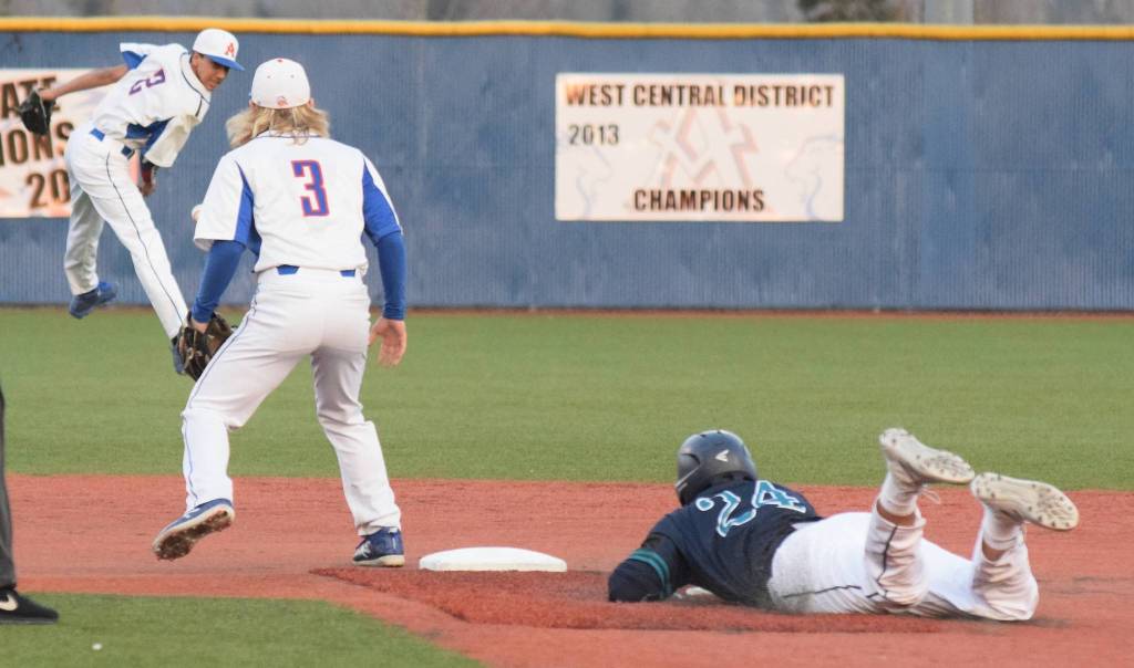 Auburn Riversides Giovani Parascondola slides safely into second base before Auburn Mountainview shortstop Vicente Feliciano can flip the ball to second baseman Cooper White. RACHEL CIAMPI, Auburn Reporter