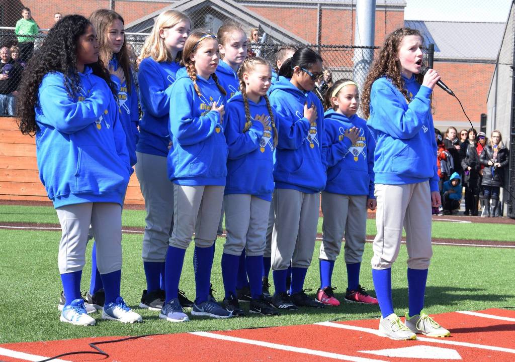 Little League softball player Maddie McCarthy sings the National Anthem with her team, the Diamond Divas. RACHEL CIAMPI, Auburn Reporter