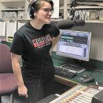 Natalie Holcomb at the mic. COURTESY PHOTO, KGRG-FM