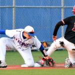 The Lions Grant Harris tags out Enumclaws Colton Willson at third base during NSPL Olympic play Thursday. RACHEL CIAMPI, Auburn Reporter
