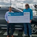 Jay Lee, general manager of Rairdons Subaru of Auburn, left, presents a check of more than $18,000 to Phil Morgan, president and CEO of the Auburn Valley Humane Society. COURTESY PHOTO