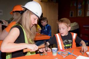 Luke Lebhart, 7, makes an art tractor with his mom, Summer, during the Ladies and Lil Gents event Saturday. RACHEL CIAMPI, Auburn Reporter