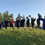 Lakeland Hills Elementary teacher Kim McKeough joins 15 of her original kindergarteners for a photo opportunity at Sunset Park. MARK KLAAS, Auburn Reporter