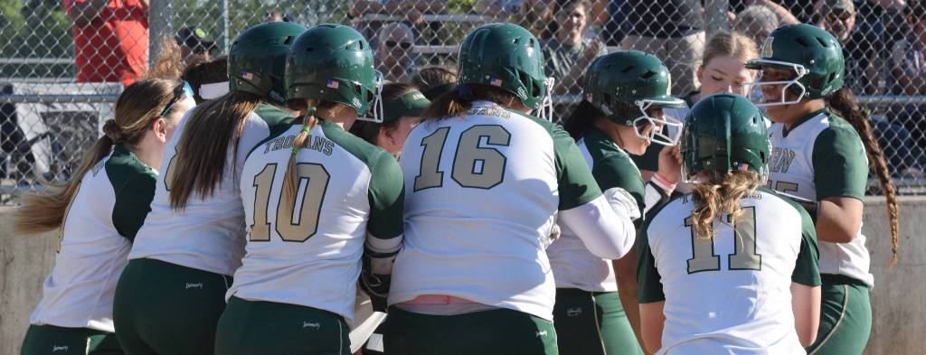 Teammates celebrate Auburns Lynetti Aumua grand slam home run against Kennedy Catholic. RACHEL CIAMPI, Auburn Reporter