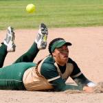Auburn shortstop Lynetti Aumua has trouble coming up with the ball during the Trojans 17-1 loss to Sumner during the bi-district tournament at the Kent Service Club Ballfields on Saturday. RACHEL CIAMPI, Auburn Reporter