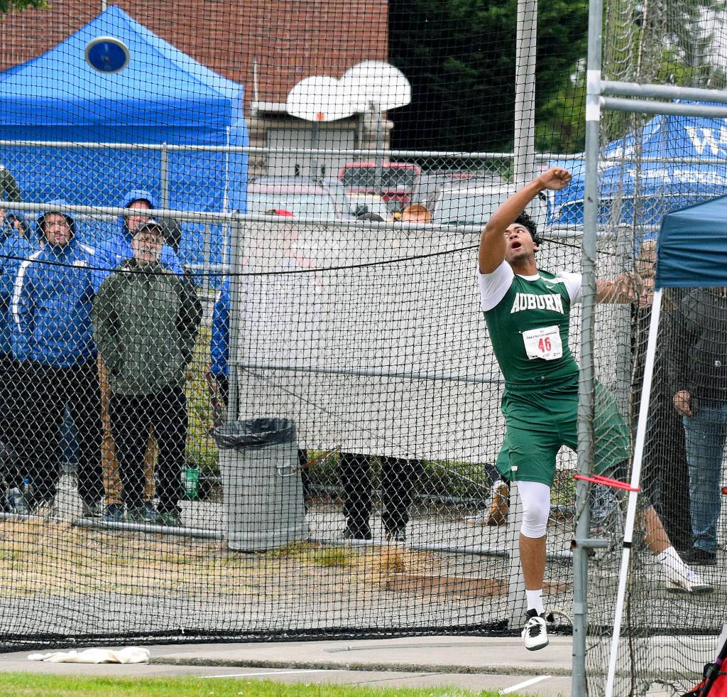 Auburns Omar Young fought the elements but secured second place in the discus with a school-record toss in the 4A final last Saturday. RACHEL CIAMPI, Auburn Reporter