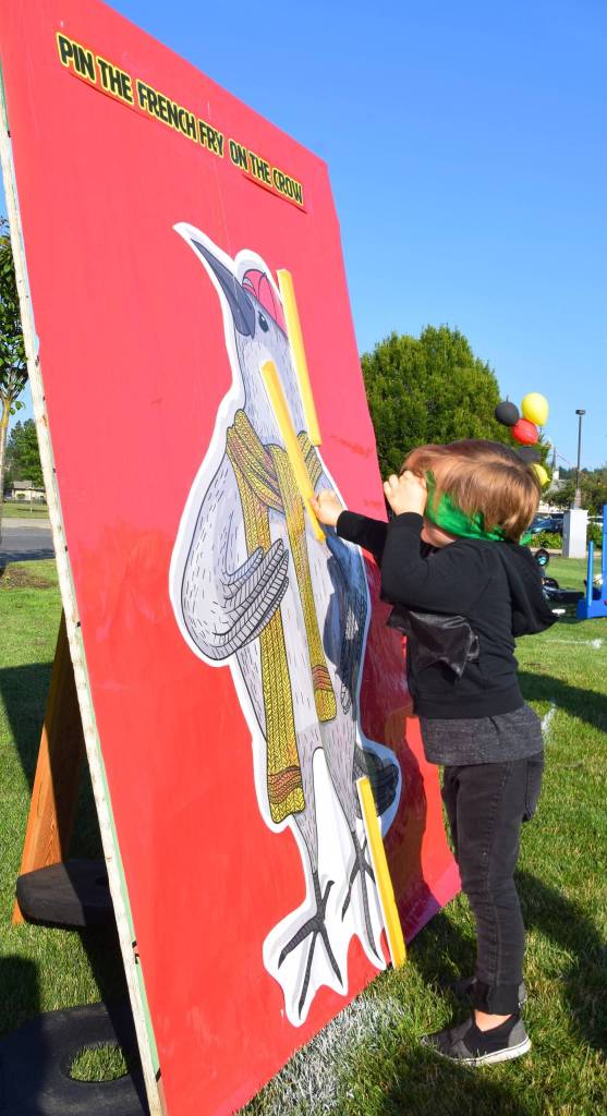 Charlie Wehunt, 3, plays Pin the French Fry on the Crow. RACHEL CIAMPI, Auburn Reporter