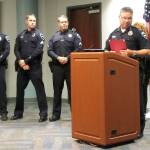 Auburn Police force honorees are, from left, Officers Devin Nelson, David Lind, Sgt. Brandon Skeen and Officer Brian Anderson. Police Chief William Pierson is at the podium, alongside Assistant Chief Mark Callier. ROBERT WHALE, Auburn Reporter