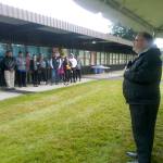 Auburn School District Superintendent Alan Spicciati addresses a crowd under cover from the rain during a groundbreaking ceremony for the new Dick Scobee Elementary School last Friday. The new school, which will replace the old one at the same location, is scheduled to open in 2020. ROBERT WHALE, Auburn Reporter