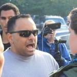 A protester yells at a supporter of the Drag Queen Story Hour at Fairwood Library on June 27. Aaron Kunkler/staff photo