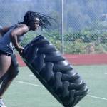 Rufina Everett, a senior and state-class shot put thrower, turns over some heavy tread during workouts Wednesday at Auburn Mountainview High School. MARK KLAAS, Auburn Reporter