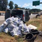 The Department of Ecology Youth Corps clean up trash littered along major Washington highways and freeways during a summer job opportunity program. COURTESY PHOTO, Steven Williams