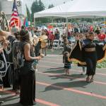 The Muckleshoot Tribe sing and dance as they welcome the public to the official groundbreaking of its luxury hotel tower Sept. 5. ROBERT WHALE, Auburn Reporter