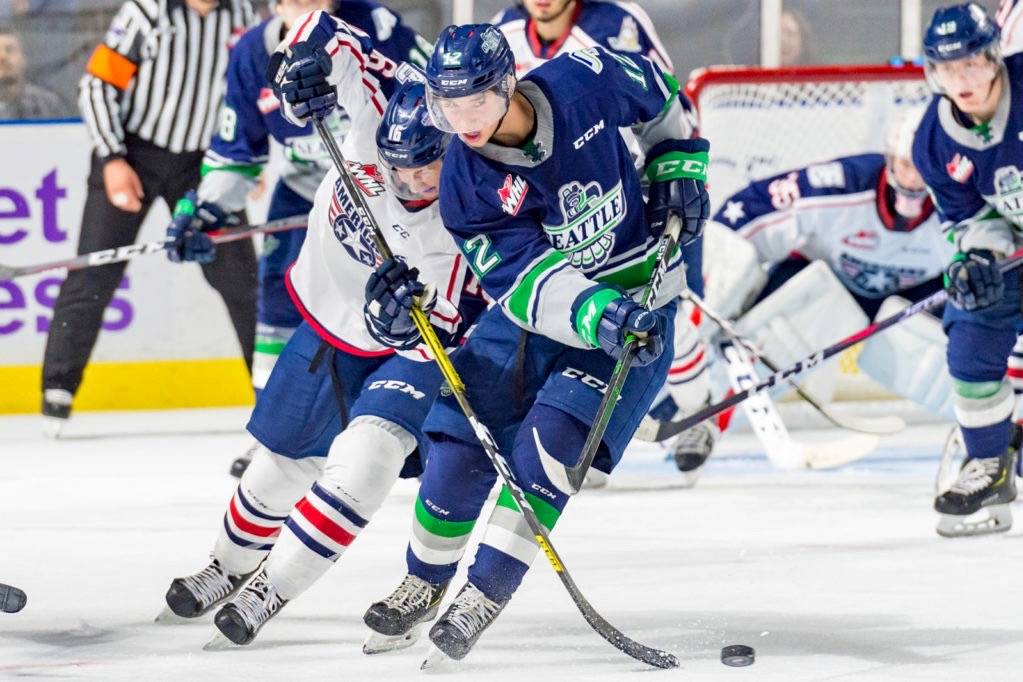 Thunderbirds center Henrik Rybinski battles the Americans Zane Franklin in bringing the puck up the ice Friday night. COURTESY PHOTO, Brian Liesse, T-Birds