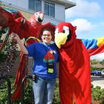 The Parrot Lady, Debbie Goodrich, and her parrot Oly, with the parrot mascot Tui. RACHEL CIAMPI, Auburn Reporter