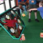 Theo Brown, 4, plays a parrot bean bag game. RACHEL CIAMPI, Auburn Reporter