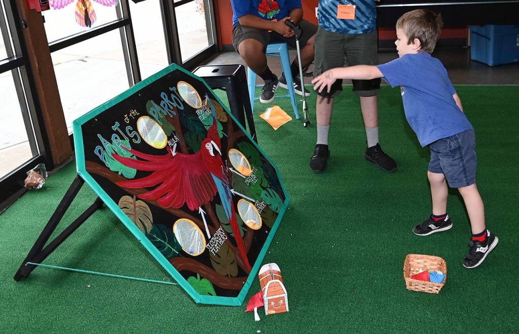 Theo Brown, 4, plays a parrot bean bag game. RACHEL CIAMPI, Auburn Reporter