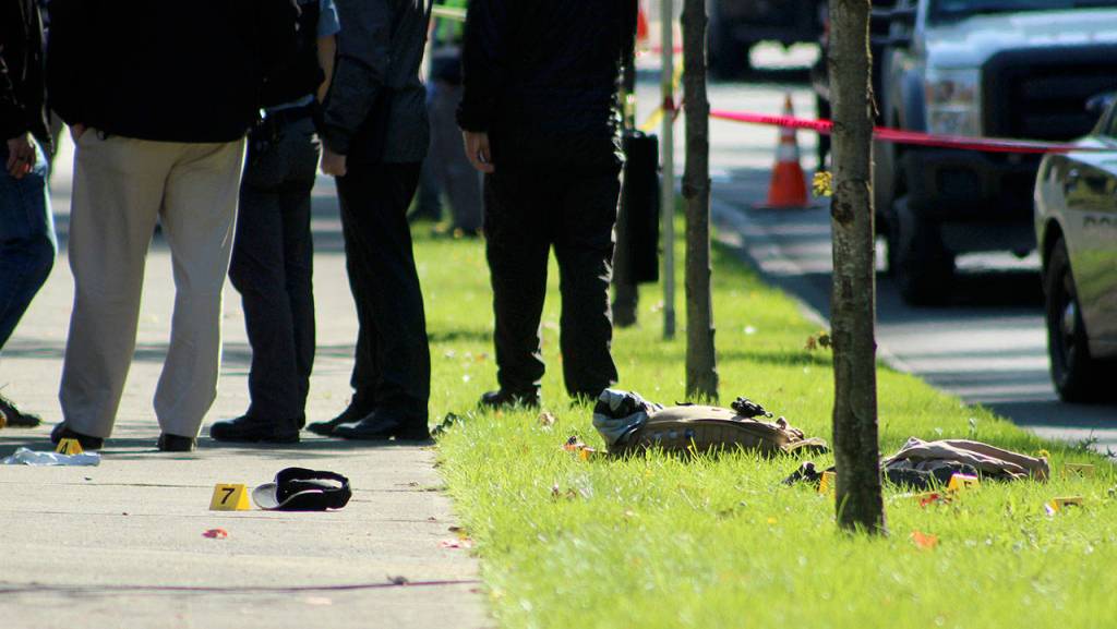 Evidence from the arrest is marked on the sidewalk along Southwest Campus Drive in Federal Way. OLIVIA SULLIVAN, Federal Way Mirror