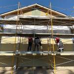 Scaffold-supported volunteers apply siding to one of three Habitat for Humanity homes in Pacific on Wednesday, Oct. 9. The volunteer effort was Habitats Global Build 2019 campaign. COURTESY PHOTO, Habitat for Humanity-Seattle-King County