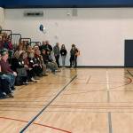 Olympic Middle School Principal Jason Hill talks to a gathering of families and supporters during a community grand opening celebration for the new school Tuesday night. RACHEL CIAMPI, Auburn Reporter
