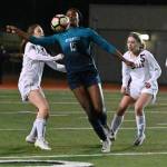 Auburn Riversides Stephanie Igwala battles for possession of the ball between Enumclaw defenders during 4A state playoff action Wednesday night. RACHEL CIAMPI, Auburn Reporter