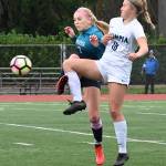 Auburn Riversides Kayla Rydberg, left, and Olympias Sarah Boatright battle for the ball. RACHEL CIAMPI, Auburn Reporter