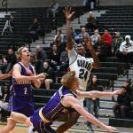 Auburns DaeKwon Watson drives past North East Bushrangers Hunter Gottschling during their game Tuesday night at Bob Jones Gymnasium. Watson scored a game-high 15 points in the Trojans 76-37 win over the visitors from Australia. RACHEL CIAMPI, Auburn Reporter