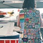 Arina Pogiolli stands at the Museum of Flight with her Girl Scout vest covered in 13-years worth of badges. COURTESY PHOTO, Poggioli