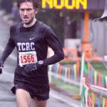 Tacomas Greg Leak reaches the finish line to capture the 10,000-kilometer win at the 36th Christmas Rush Fun Run And Walk. Leaks winning time of 29 minutes, 57.1 seconds was the first sub-30 time in the Kent run in 27 years. MARK KLAAS, Kent Reporter