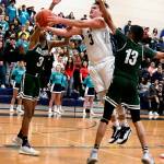 The Ravens Cole Lenihan goes for the shot between Auburn defenders. RACHEL CIAMPI, Auburn Reporter