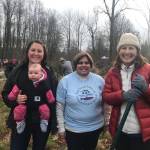 Katie Beavers, King County lower Green basin steward, Jeanette Dorner, executive director of the Mid-Sound Fisheries Enhancement Group, and US 8th District Congresswoman Kim Schrier, D-Issaquah, take a break from riverbank restoration work at Fenster Park Monday morning. COURTESY PHOTO