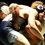 Trojans upend Ravens in showdown, 34-33
