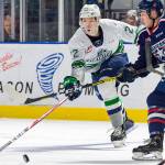 Seattles Luke Bateman battles for the puck Tuesday night against Tri-Citys Edge Lambert at the accesso ShoWare Center. COURTESY PHOTO, Brian Liesse, T-Birds