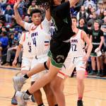 Auburns Darrell Hester goes for the shot as Auburn Mountainviews Kameron Earl defends during NPSL Olympic play Wednesday night. RACHEL CIAMPI, Auburn Reporter
