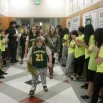 Lizzy Souers leads her teammates through the halls of Auburn High School en route to the gymnasium during a Walk of Champions for the Auburn Unified Special Olympics basketball team Tuesday. MARK KLAAS, Auburn Reporter