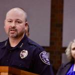 Kent Police Chief Rafael Padilla, with Mayor Dana Ralph listening, talks to the media about the King County-owned quarantine/isolation facility in Kent during a news conference Friday. City officials are concerned about the safety of the former Econo Lodge motel after a patient fled from the facility, shoplifted a convenience store and boarded a bus. MARK KLAAS, Kent Reporter