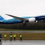 Workers cheer and wave as Boeings 787 Dreamliner takes off from Paine Field on Dec. 15, 2009. (Justin Best/ Herald file)