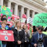WNPA News Service                                Dissatisfied residents hold signs in protest of comprehensive sex education mandate earlier this year.