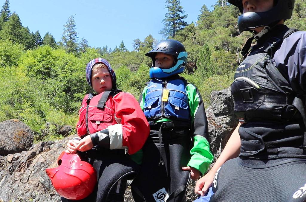 Courtesy photo
Ivan Knight, then 8, scouts the Rogue Rivers Class IV Blossom Bar rapid in 2019 with his sister, Tilly Jane, then 11, and friend Judah Harms, then 13. All three whitewater kayaked the entire length of Oregons 36-mile Wild and Scenic classic river. In 2020, Ivan and Tilly Jane whitewater kayaked all 130 miles of Idahos Main Salmon River.